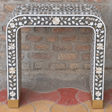 Handmade black Mother of Pearl inlay console table with floral vine design, curved waterfall legs and gold-tone feet