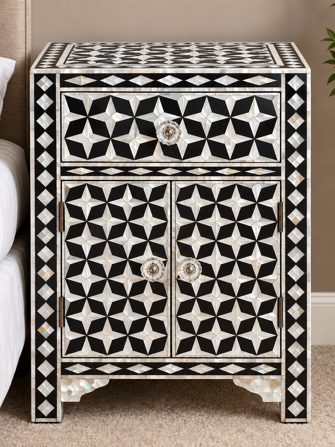 Black Mother of Pearl bedside cabinet with geometric star pattern, one drawer and two doors