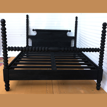 Hand-carved black solid wood four-poster bed frame with turned bobbin posts and wooden slats