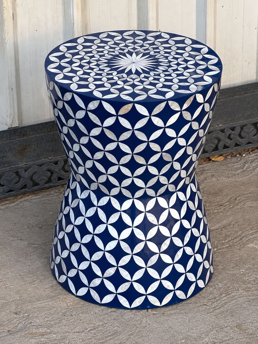 Blue Mother of Pearl inlay round end table with geometric petal pattern and curved drum shape