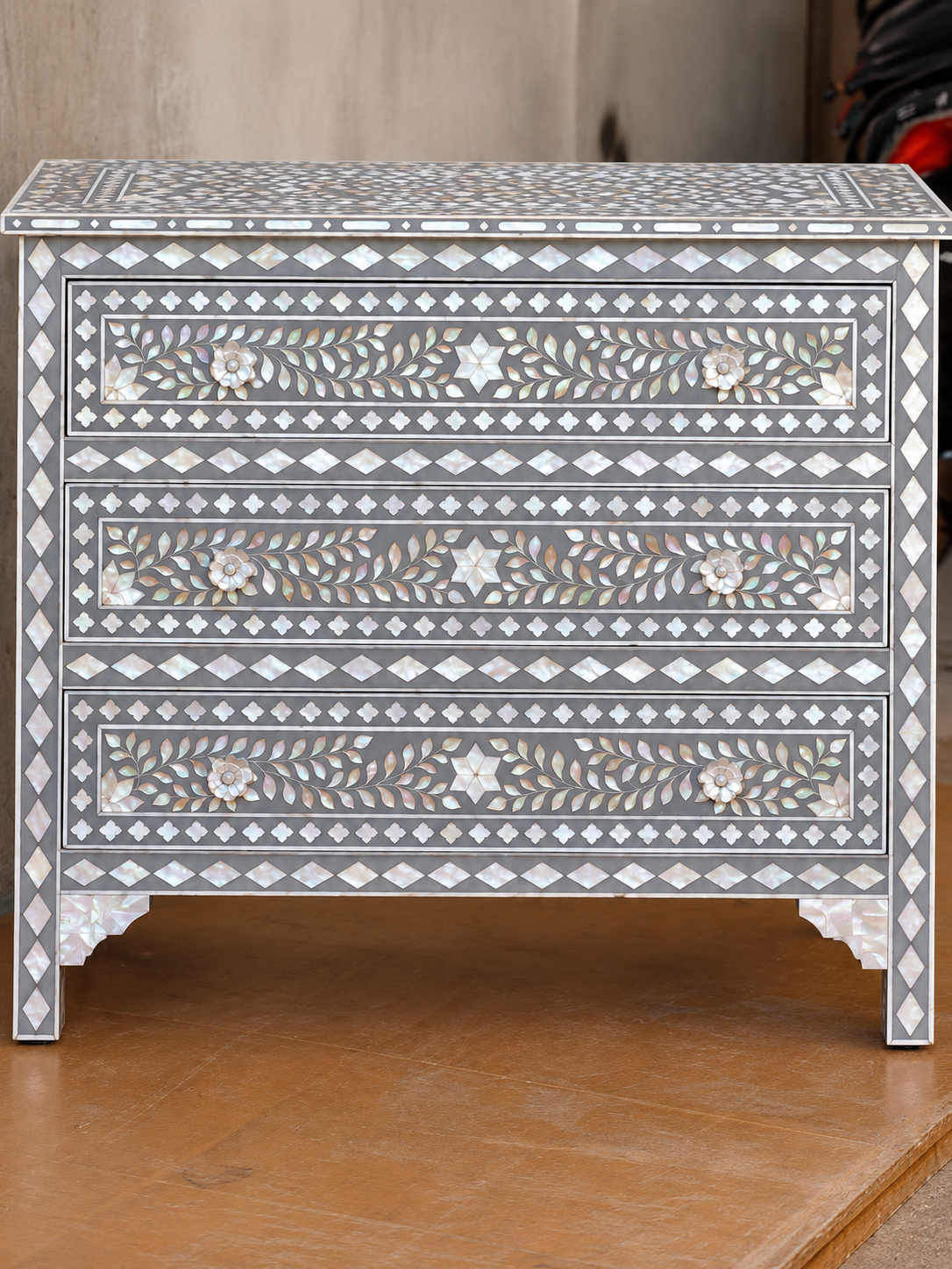 Grey mother of pearl inlay chest of drawers with three drawers, floral vine pattern and geometric border