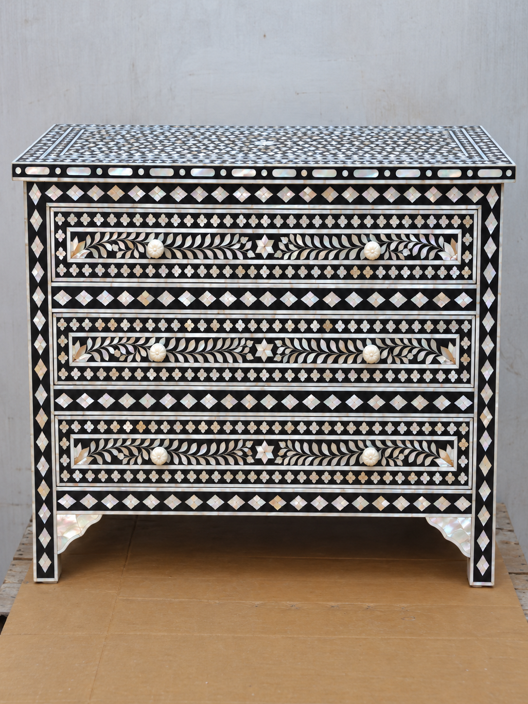 Black mother of pearl inlay chest of drawers with three drawers and handmade floral leaf design