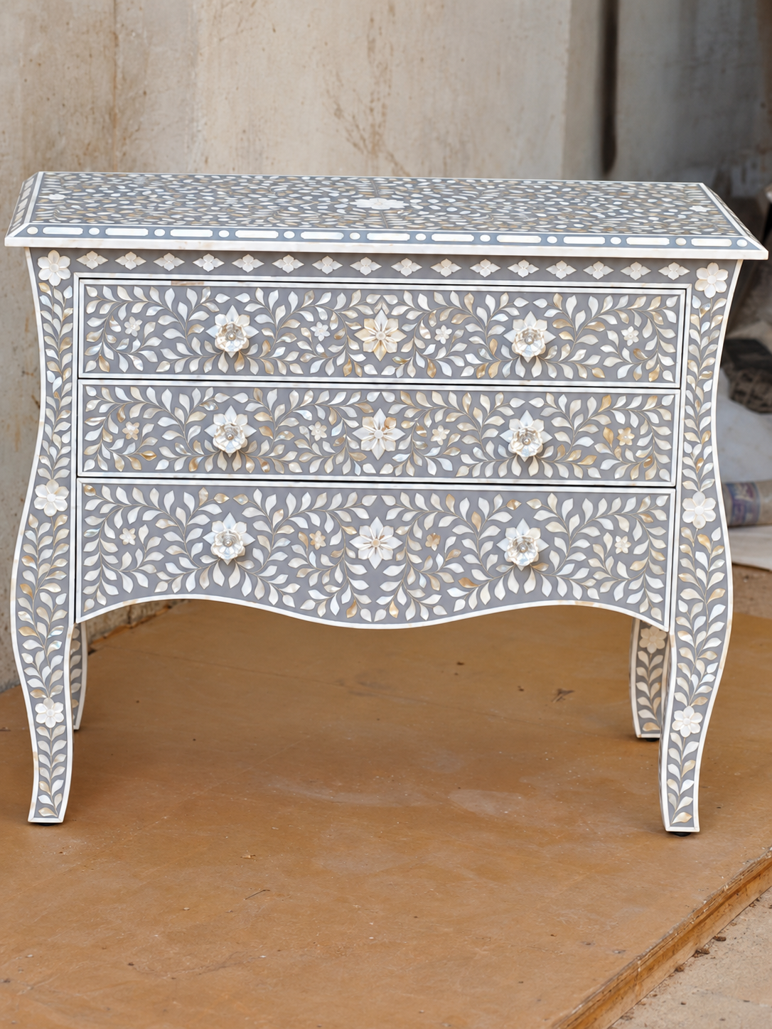 Grey mother of pearl inlay chest of drawers with three drawers, floral pattern and curved legs